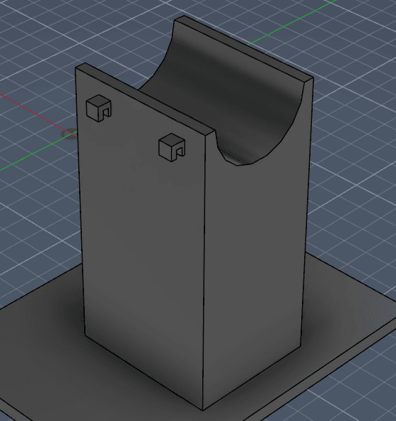 Fusion model of the first motor bracket: a half-pipe cradle on a tall block.